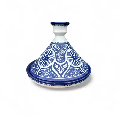 a blue and white vase on a white background at Fès Dar medina in Fès