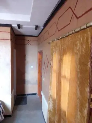 a room with a wall with graffiti on it at Ait Sedrate Tourism Cooperative Hotel in Boumalne