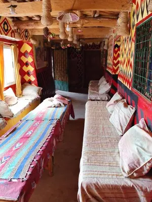 a row of beds sitting in a room at gite Imouzar in Iabassene