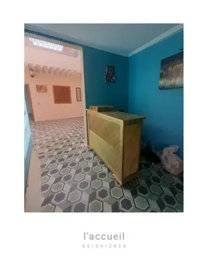 a room with a desk and a blue wall at House Medina Villa in Salene