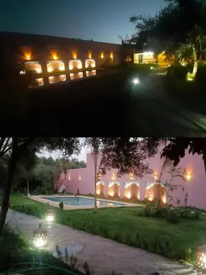 two pictures of a building with lights at night at House Medina Villa in Salene