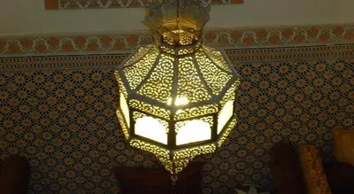 a chandelier hanging from the ceiling in a room at Dar Tadla Fes in Fès