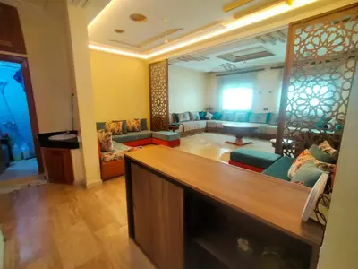 a living room with a couch and a table at Célia House in Fès