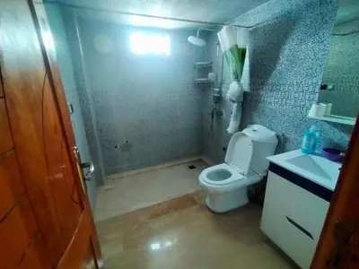 a bathroom with a shower and a toilet and a sink at Célia House in Fès