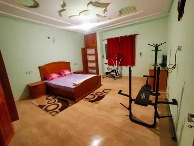 a bedroom with a bed and a tripod in a room at Célia House in Fès