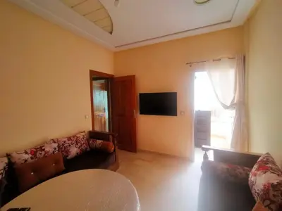 a living room with a couch and a table at Célia House in Fès