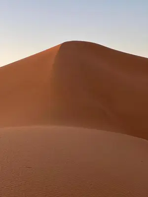a sand dune in the middle of the desert at Iriki Dreams in Bou Rbia