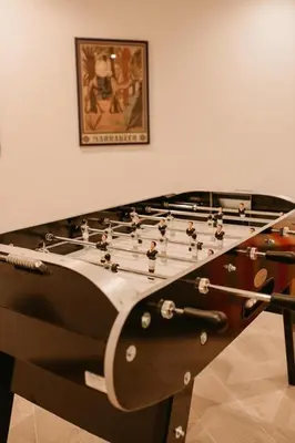 a foosball table with at Luxury 5-Suite Villa with Heated Pool, Steam Room & Games in Marrakech