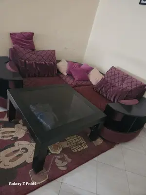 a living room with a couch and a coffee table at اناسي مرجان مكناس in Meknès