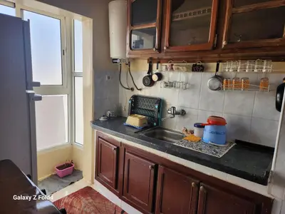a kitchen with a sink and a window at اناسي مرجان مكناس in Meknès