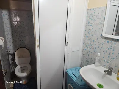 a small bathroom with a toilet and a sink at اناسي مرجان مكناس in Meknès