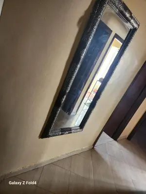 a mirror on the side of a wall with a window at اناسي مرجان مكناس in Meknès