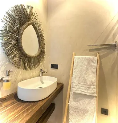 a bathroom with a sink and a mirror on a counter at VILLA 2s in Marrakech
