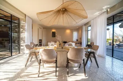 a dining room with a table and chairs at VILLA 2s in Marrakech