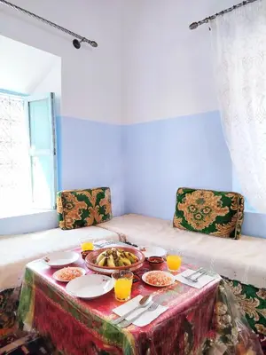a table with a plate of food on it at Tagmat guest house in Toufrine