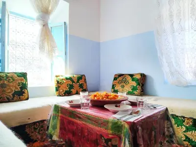a room with a table with a bowl of food on it at Tagmat guest house in Toufrine