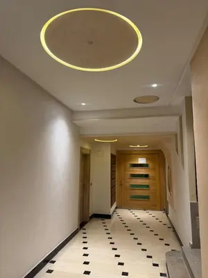 a hallway with a ceiling with a clock on it at Chic and comfortable air-conditioned apartment in Fès