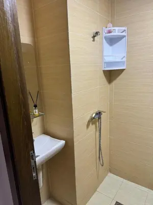 a small bathroom with a sink and a toilet at Chic and comfortable air-conditioned apartment in Fès