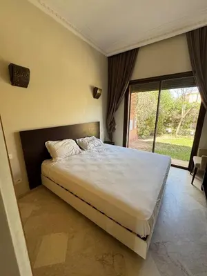 a bedroom with a large bed and a large window at Beautiful Villa near Marrakesh in Marrakech