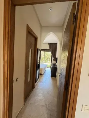 a hallway leading to a living room with a couch at Beautiful Villa near Marrakesh in Marrakech