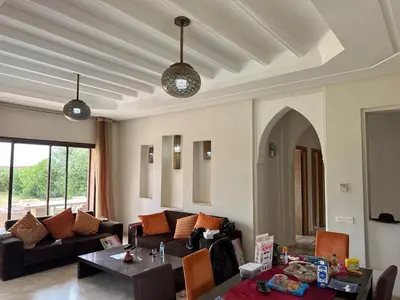 a living room with a couch and a table at Beautiful Villa near Marrakesh in Marrakech