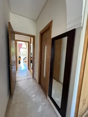 a hallway with two doors and a mirror on the wall at Beautiful Villa near Marrakesh in Marrakech