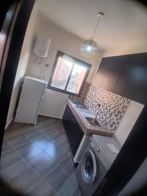 an overhead view of a bathroom with a washing machine at Appartement a marrakech in Oulad Akkou