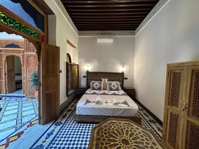 a bedroom with a bed in a room at Riad Joseph in Fès