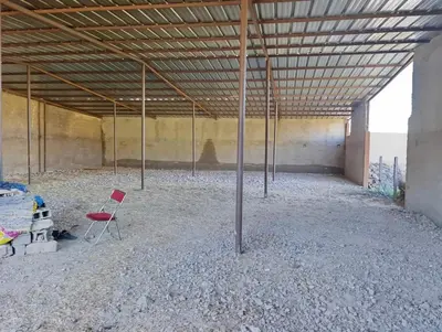 an empty room with a red chair in it at Villa montysco in Hal Sabek