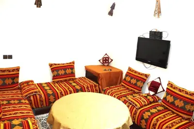 a living room with couches and a tv at agdz in Agdz