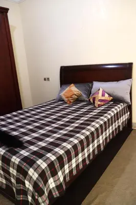 a bed with two pillows sitting on top of it at agdz in Agdz
