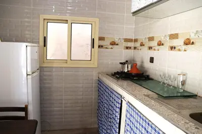 a kitchen with a sink and a window at agdz in Agdz