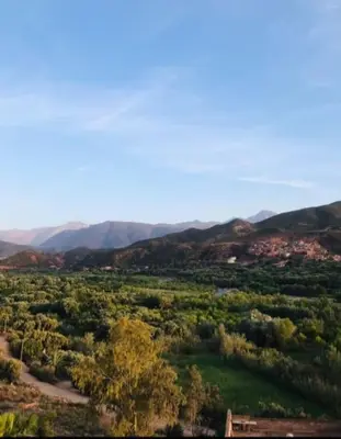 an aerial view of a field with mountains in the background at villa maya in Ourika