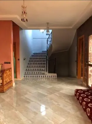 an empty room with a staircase in a house at villa maya in Ourika