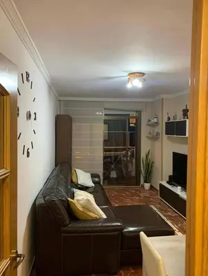 a living room with a leather couch in a room at inozar in Azrou