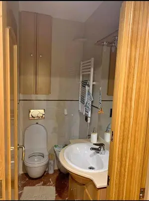 a bathroom with a toilet and a sink at inozar in Azrou