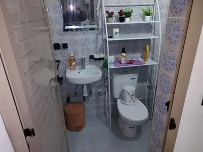 a small bathroom with a toilet and a sink at apartment for rent by days in Zagora