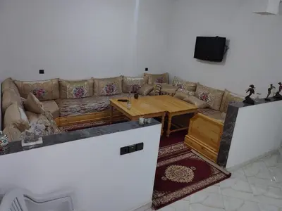 a living room with a couch and a table at apartment for rent by days in Zagora