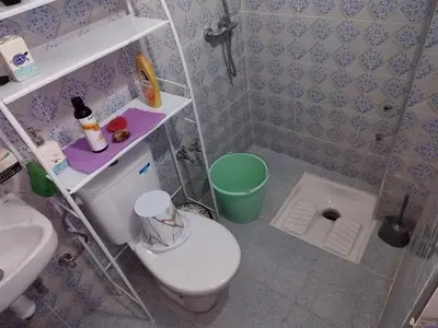 a small bathroom with a toilet and a sink at apartment for rent by days in Zagora