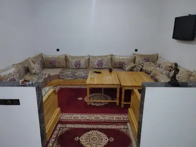 a living room with a couch and a table at apartment for rent by days in Zagora