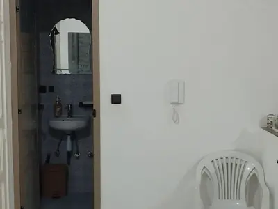 a bathroom with a sink and a mirror at apartment for rent by days in Zagora