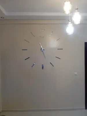 a clock hanging on a wall in a room at Jana in Meknès