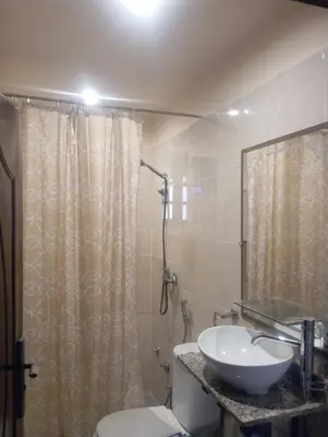 a bathroom with a sink and a toilet and a shower at Jana in Meknès