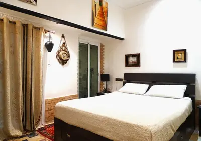 a bedroom with a large bed and a window at Moroccan apartment riad style in Fès