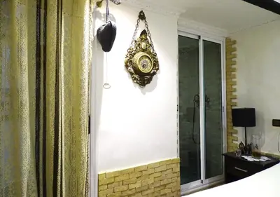 a mirror hanging on a wall in a room at Moroccan apartment riad style in Fès