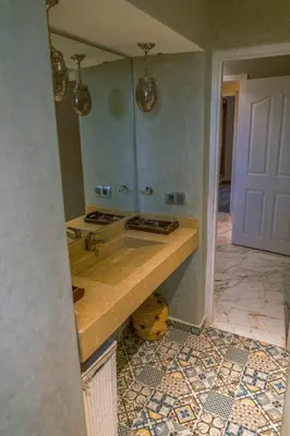 a bathroom with a sink and a mirror at Villa Azuréa with pool 4 bedrooms and 2 living rooms in Ourika