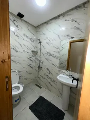 a bathroom with a sink and a toilet and a mirror at Etoile De Sidi Harazem in Station de Sidi Harazem