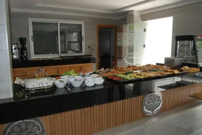 a buffet line with many different types of food at Hôtel Asswar Al Madina in Fès