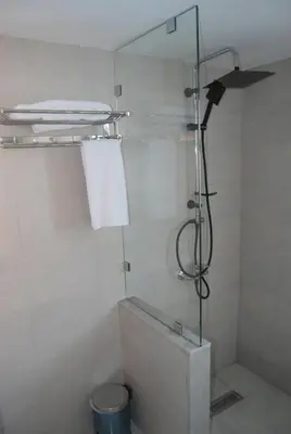 a glass shower in a bathroom with a toilet at Hôtel Asswar Al Madina in Fès