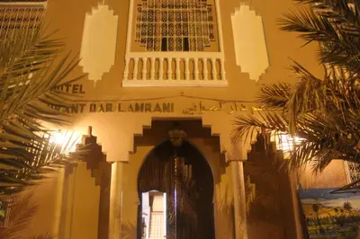 an entrance to a building with a sign that reads park bar lan istg at Dar Lamrani in Rissani